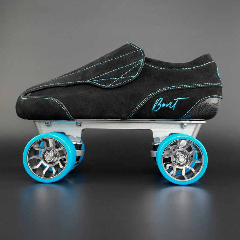 Side view of skate with Envy Carbon boot, Moonwalk wheels, and Tracer plate