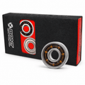 Black-and-red Bont Black Series bearing box with one open steel bearing standing in front.