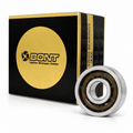 Black-and-gold Bont ceramic bearing box with an open bearing showing its steel rings and plastic cage.