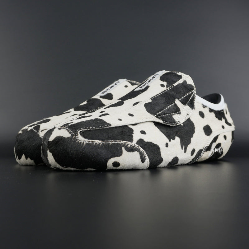 Angled view showing natural brown and white leather contrast