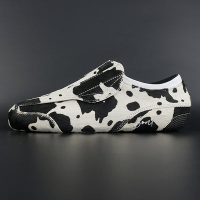 Side view of Envy Cow Skin Roller Skate showing cowhide pattern