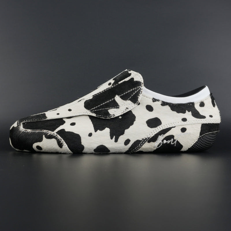 Side view of Envy Cow Skin Roller Skate showing cowhide pattern