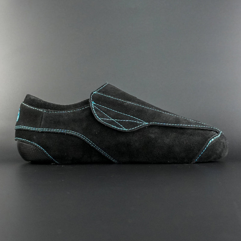 Side view of the Envy suede skate showing black suede finish