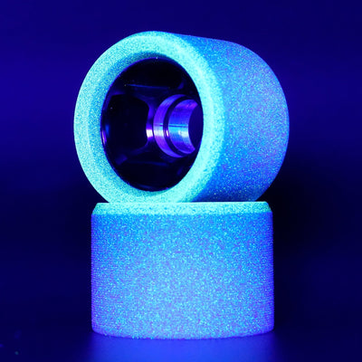 Royal Assassin Indoor UV wheels glowing under blacklight at a rink