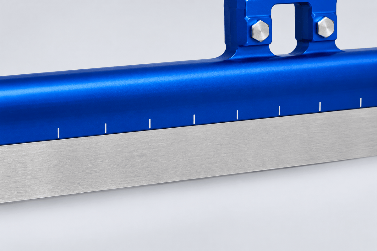 Close-up of the white bending reference marks along the blue GT3 blade tube above the steel runner.