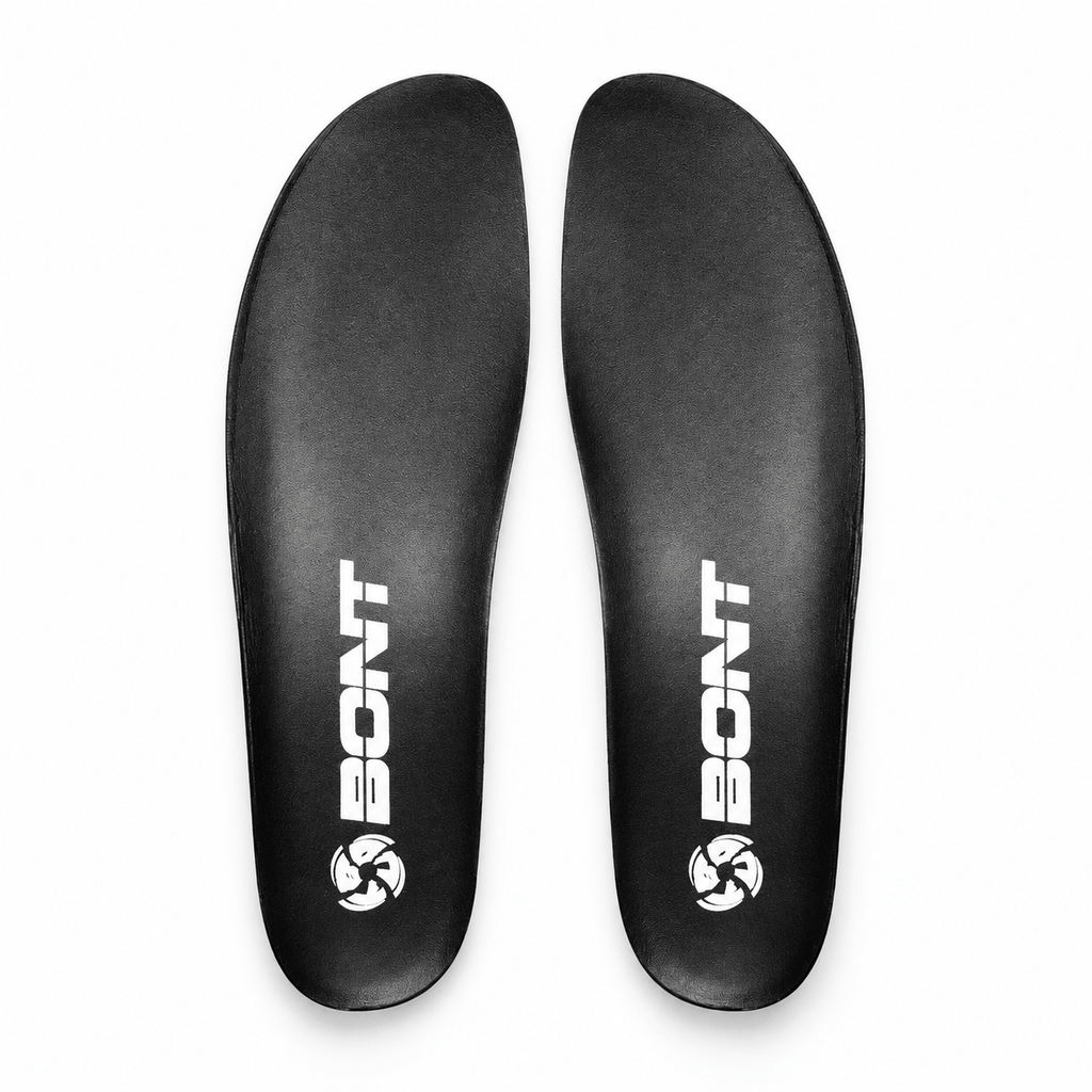 Studio view of a pair of thin black EVA skate insoles for inline, roller, and ice boots.